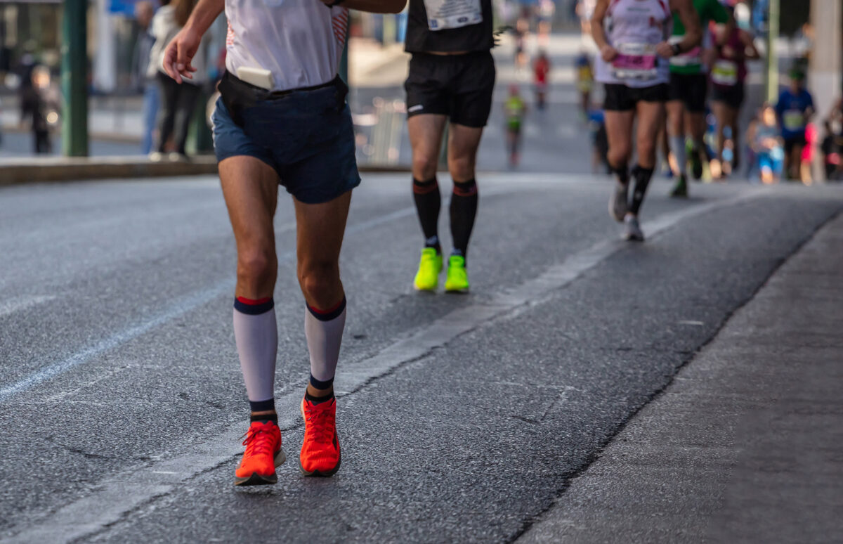 marathon-running-race-runners-running-city-roads-detail-legs.jpg